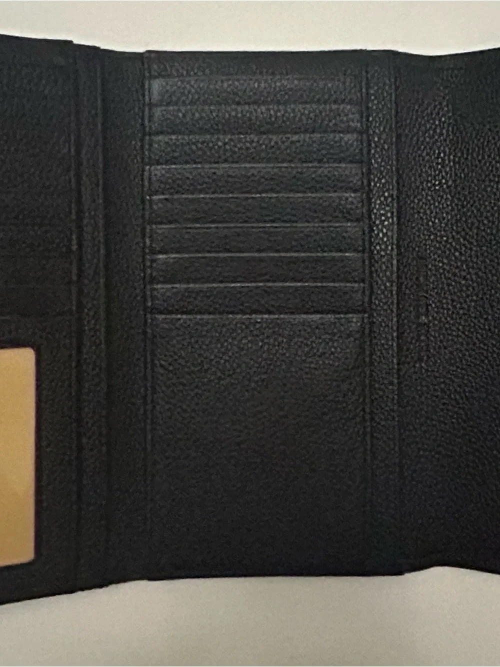Michael Kors White Perforated Satchel with Black Trim and matching black wallet.